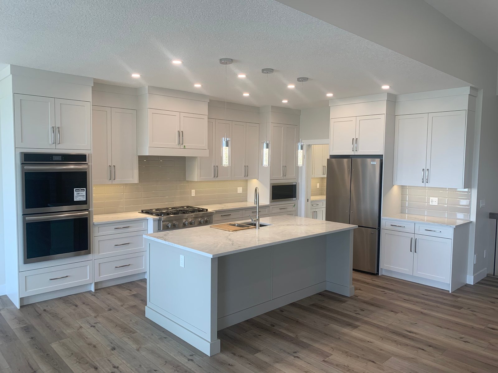 Bright white kitchen with a large centre island